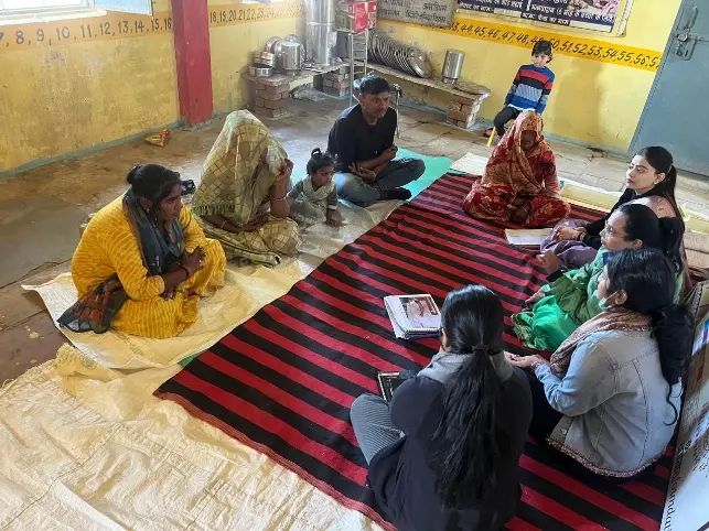 Ramayani Didi sitting in CAAA meeting with other two volunteers from village