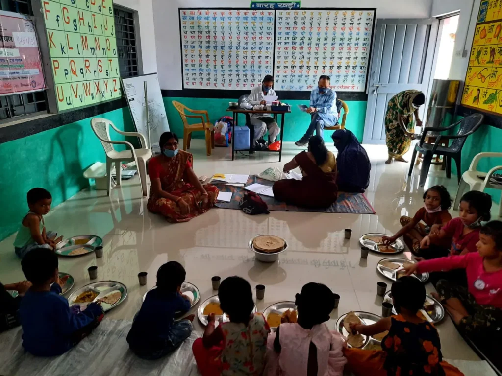 Mitra ji capturing data in an Anganwadi meeting