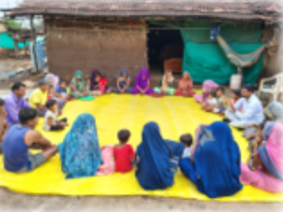 Giyan leading a community meeting at a faliya