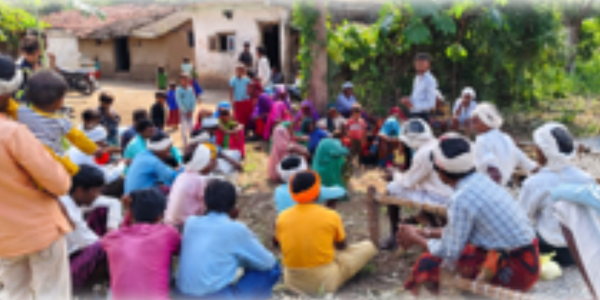 Siyaram leading a discussion with community members